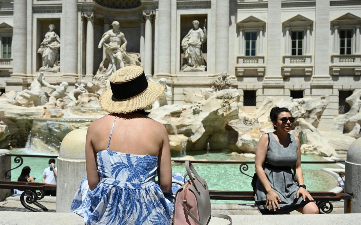 Tourists at the Trevi Fountain in Rome  - AFP