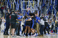 Kentucky players celebrate after beating South Carolina in the NCAA women's college basketball Southeastern Conference tournament championship game Sunday, March 6, 2022, in Nashville, Tenn. Kentucky won 64-62. (AP Photo/Mark Humphrey)