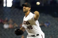 Arizona Diamondbacks' Madison Bumgarner delivers against the Atlanta Braves during the first inning of a baseball game Thursday, Sept 23, 2021, in Phoenix. (AP Photo/Darryl Webb)