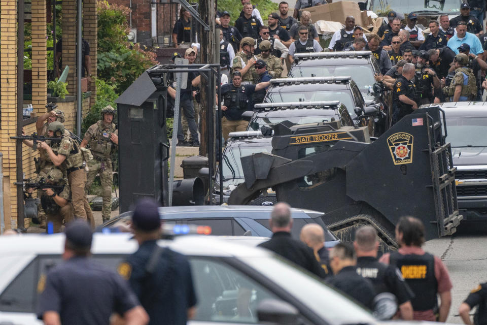 Pittsburgh police prepare to deploy an armored vehicle with a ramming device as they and other law personnel respond to an active shooter situation in the Garfield neighborhood of Pittsburgh on Wednesday, Aug. 23, 2023. (Benjamin B. Braun/Pittsburgh Post-Gazette via AP)