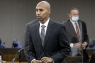 Former officer Mohamed Noor makes his way to the podium to address Judge Kathryn Quaintance at the Hennepin County Government Center, Thursday, Oct. 21, 2021 in Minneapolis. The Minneapolis police officer who fatally shot an unarmed woman after she called 911 to report a possible rape happening behind her home was sentenced Thursday to nearly five years in prison — the most the judge could impose but less than half the 12½ years he was sentenced to for his murder conviction that was overturned last month. (Elizabeth Flores/Star Tribune via AP, Pool)