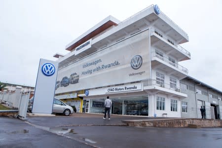 A man walks outside Volkswagen's car production plant in Kigali