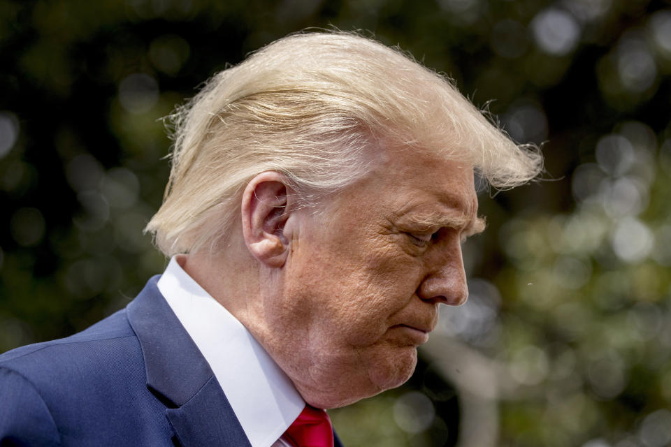 President Donald Trump pauses while speaking with members of the media before boarding Marine One on the South Lawn of the White House in Washington, Thursday, Aug. 6, 2020, for a short trip to Andrews Air Force Base, Md. and then on to Cleveland, Ohio. (AP Photo/Andrew Harnik)