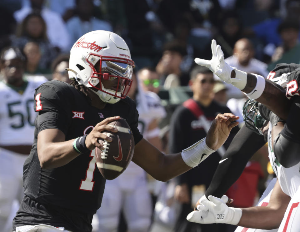 Houston quarterback Donovan Smith scrambles out of the pocket during the first half of an NCAA college football game against Baylor, Saturday, Nov. 4, 2023, in Waco, Texas. (Rod Aydelotte/Waco Tribune-Herald via AP)