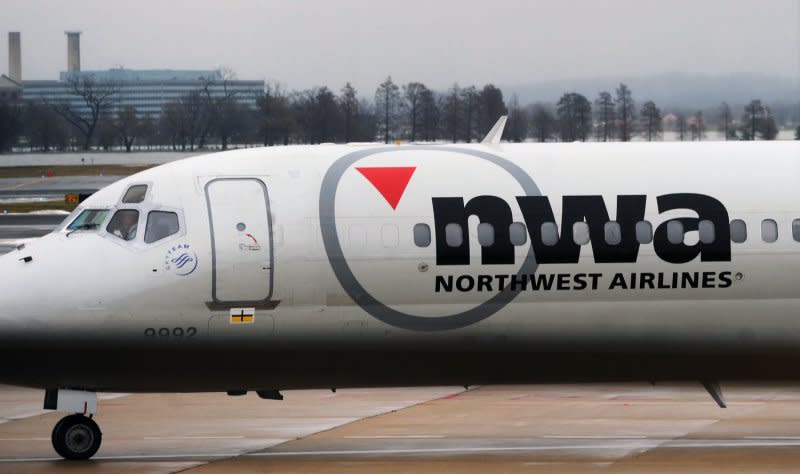 A Northwest Airlines airplane approaches a gate at Reagan National Airport in Arlington, Va., on December 26, 2009. On September 14, 2005, Delta Air Lines and Northwest Airlines, the third and fourth largest U.S. air carriers, filed for bankruptcy as the industry reeled under record high jet fuel costs. File Photo by Alexis C. Glenn/UPI