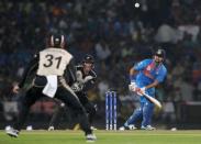 Cricket - New Zealand v India - World Twenty20 cricket tournament - Nagpur, India, 15/03/2016. India's Suresh Raina (R) plays a shot that is caught out by New Zealand's Martin Guptill. REUTERS/Danish Siddiqui