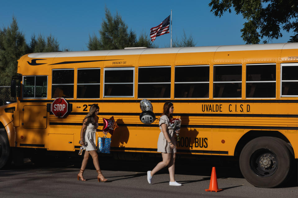 Kids walk onto a school bus