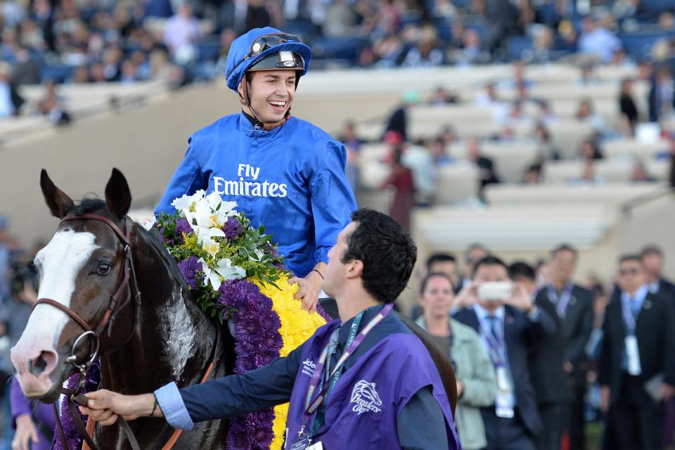 Nov 4, 2017; Del Mar, CA, USA; Talismanic jockey Mickael Barzalona smiles after winning the 11th race during the 34th Breeders Cup world championships at Del Mar Thoroughbred Club.