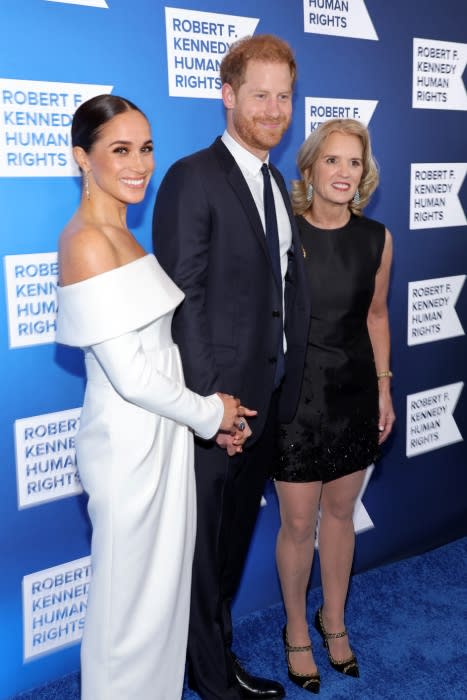 Meg and Harry on blue carpet of Ripple of Hope awards