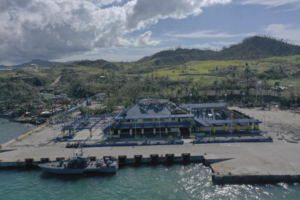 In this photo provided by the Philippine Navy, debris are scattered around the damaged Lipata port in Surigao city, Surigao del Norte province, southern Philippines on Friday, Dec. 17, 2021. The governor of an island province in the central Philippines said dozens of people died in the devastation wrought by Typhoon Rai in just half of the towns that managed to contact him, bringing the death toll in the strongest typhoon to batter the country this year to nearly 100. (Philippine Navy via AP)