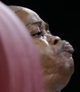 Nigeria's Felix Expo competes during the men's 77-kg, group B, weightlifting competition at the 2012 Summer Olympics, Wednesday, Aug. 1, 2012, in London. (AP Photo/Hassan Ammar)