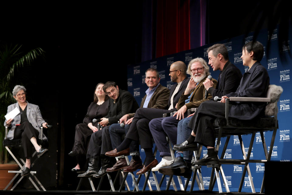 SANTA BARBARA, CALIFORNIA - FEBRUARY 13: (L-R) Moderator Anne Thompson, Samy Burch, Arthur Harari, David Hemingson, Cord Jefferson, Tony McNamara, Josh Singer, and Celine Song speak onstage at the Writers Panel during the 39th Annual Santa Barbara International Film Festival at The Arlington Theatre on February 13, 2024 in Santa Barbara, California. (Photo by Rebecca Sapp/Getty Images for SBIFF)