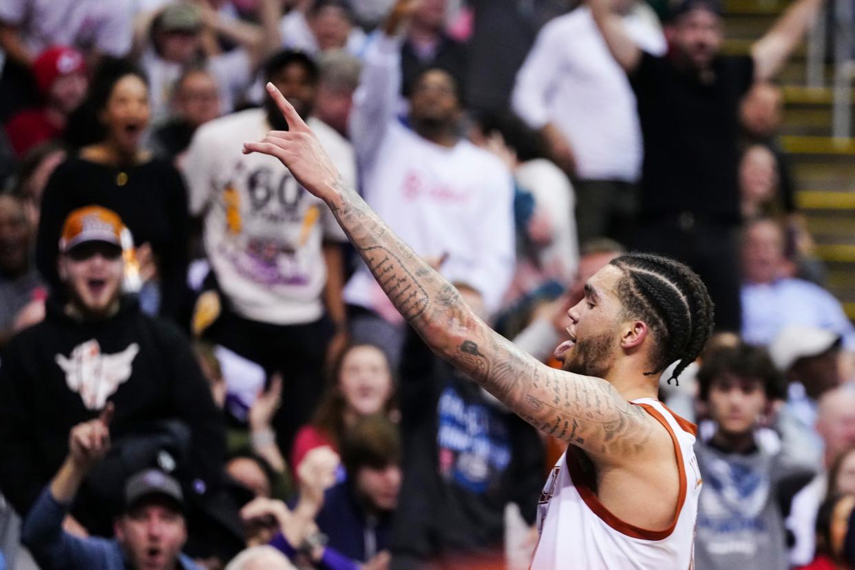 Texas forward Timmy Allen celebrates after he his buzzer-beating half-court shot right before halftime in Friday night's 83-71 win over Xavier in the Sweet 16 of the NCAA Tournament at T-Mobile Center in Kansas City. The Horns face Miami in Sunday's regional final with the winner advancing to the Final Four in Houston.