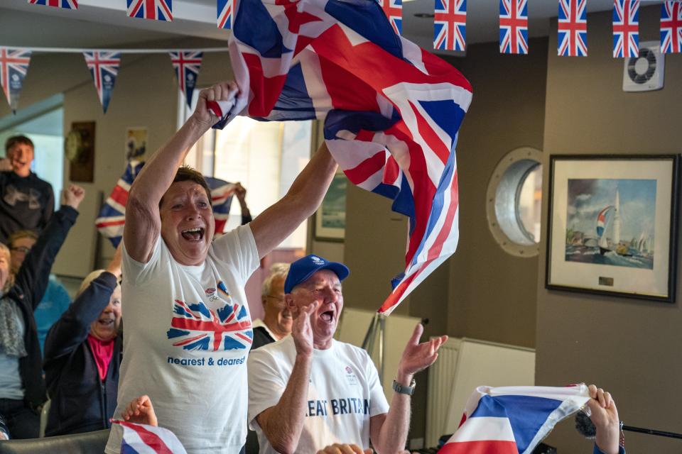 Vivian and Leslie Bithell watch their son Stuart Bithell and his helm Dylan Fletcher win a gold medal in the 49er medal race (Peter Byrne/PA) (PA Wire)