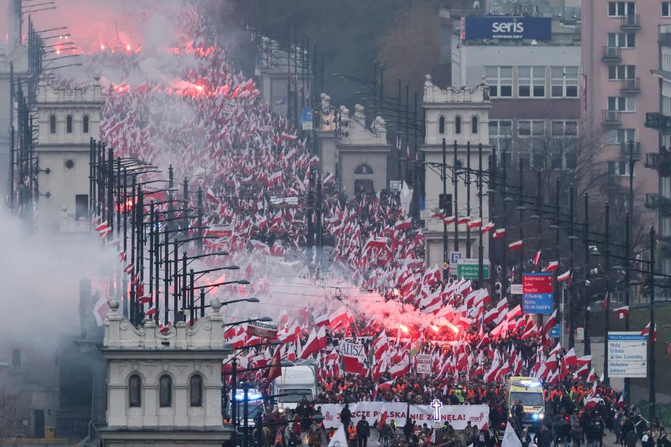 People take part in the Independence March 'Poland Is Not Yet Lost' in Warsaw, Poland on Saturday (EPA)