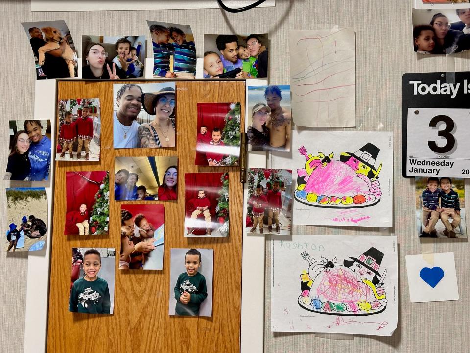 Messages hang on a wall next to Tariq Massenburg's bed at Whittier Rehabilitation Hospital.