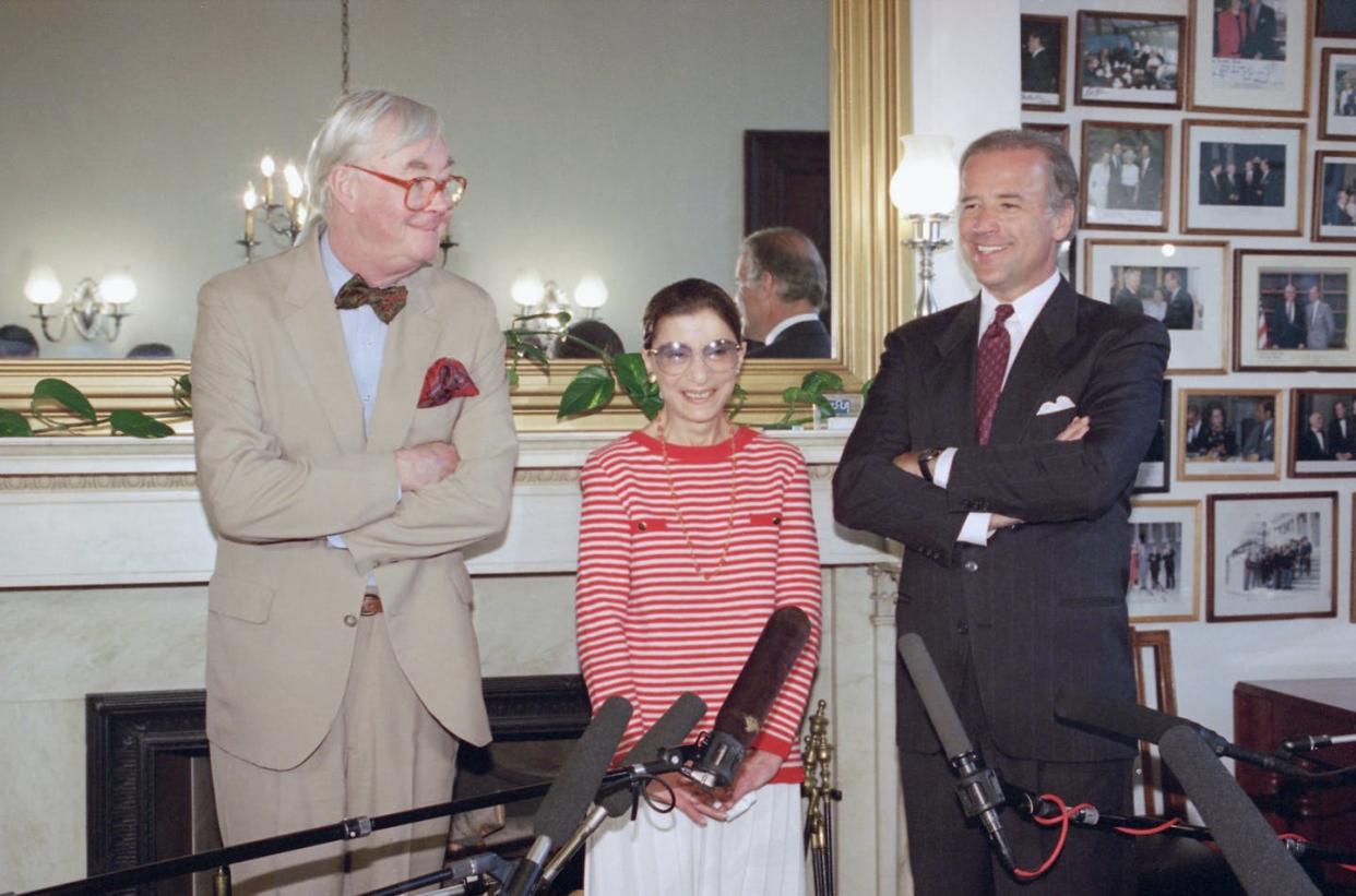 <span class="caption">Judge Ruth Bader Ginsburg paying a courtesy call on Sen. Daniel Patrick Moynihan, D-N.Y., left, and Sen. Joseph Biden, D-Del., in June 1993, before her confirmation hearing for the Supreme Court. </span> <span class="attribution"><span class="source">AP/Marcy Nighswander</span></span>