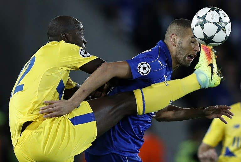 Porto's Portuguese midfielder Danilo (L) vies with Leicester City's Algerian striker Islam Slimani during their UEFA Champions League group G match in Leicester on Septemeber 27, 2016