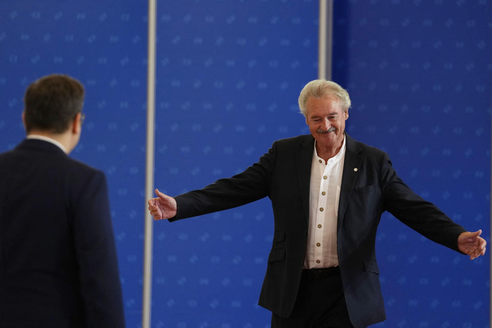 Luxembourg's Foreign Minister Jean Asselborn, right, is welcomed by Czech Republic's Foreign Minister Jan Lipavsky as he arrives for a meeting of EU Foreign Ministers at the Prague Congress Center in Prague, Czech Republic, Tuesday, Aug. 30, 2022. (AP Photo/Petr David Josek)