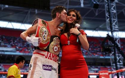 Jamie McDonnell steals a kiss after a 2014 victory. (Photo by Scott Heavey/Getty Images)