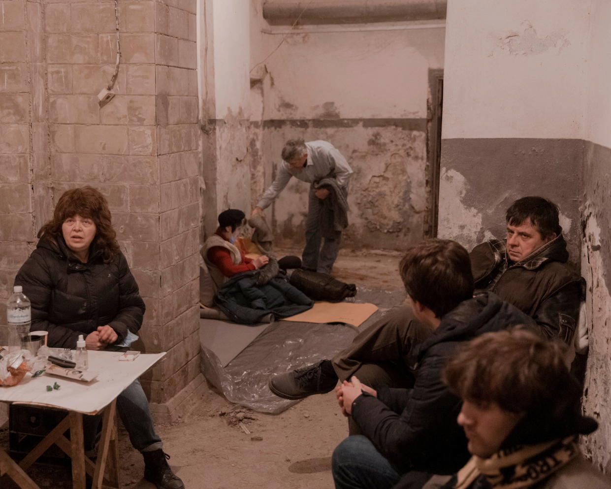 Residents take shelter in the basement of an apartment building, after Russia launched a massive military operation against Ukraine, in Kyiv, Ukraine late February 26, 2022. Picture taken February 26, 2022. Jedrzej Nowicki/Agencja Wyborcza.pl via REUTERS ATTENTION EDITORS - THIS IMAGE WAS PROVIDED BY A THIRD PARTY. POLAND OUT. NO COMMERCIAL OR EDITORIAL SALES IN POLAND.