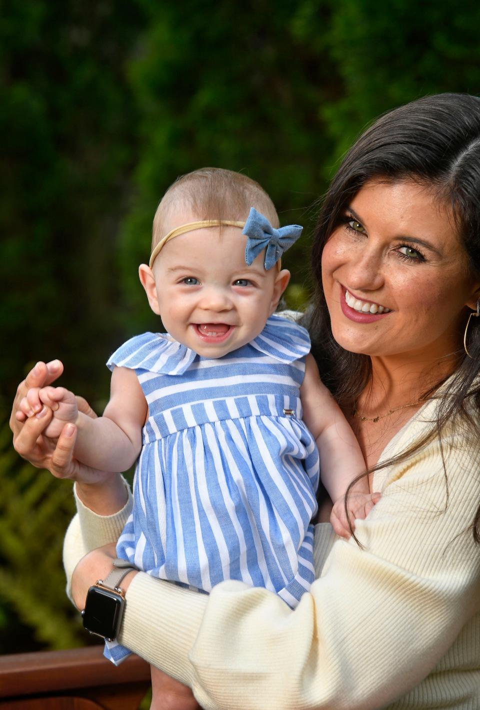 News 2 morning anchor Nikki Burdine gets a big smile from her baby, Andi, at their home in Nashville, Tenn. Thursday, April 23, 2020.