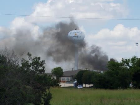 Smoke rises above the Coryell Memorial Hospital in Gatesville, Texas, U.S., June 26, 2018 in this picture obtained from social media. GLENN JONES/via REUTERS