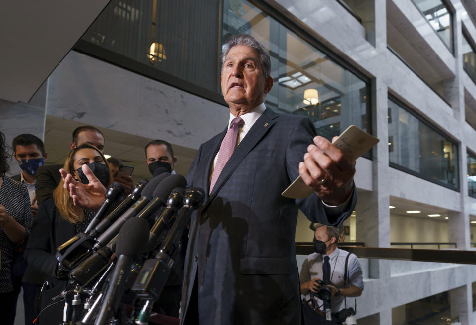 Sen. Joe Manchin, D-W.Va., a key holdout vote on President Joe Biden's domestic agenda, makes a statement to reporters about Republicans and Democrats resolving their fight over raising the debt limit, at the Capitol in Washington, Wednesday, Oct. 6, 2021. (AP Photo/J. Scott Applewhite)