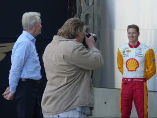 <em>Josef Newgarden poses for sculptor William Behrends the day after winning the 107th Indy 500 (Bruce Martin Photo).</em>