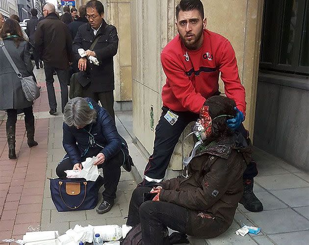 A bloodied commuter is treated outside the train station following the bombing. Photo: Getty Images