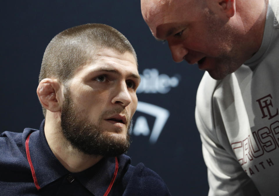 Khabib Nurmagomedov, left, listens to Dana White during a news conference for the UFC 229 mixed martial arts bouts Thursday, Oct. 4, 2018, in Las Vegas. Nurmagomedov is scheduled to fight Conor McGregor on Saturday in Las Vegas. (AP Photo/John Locher)