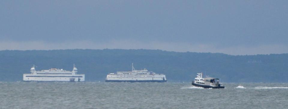 Woods Hole, Martha's Vineyard and Nantucket Steamship Authority ferries pass each other on the route between Woods Hole and the Vineyard, in September 2022.