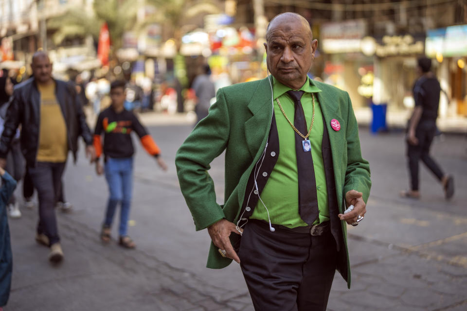 A man makes his way to the al-Kadhimayn shrine in Baghdad, Iraq, Saturday Feb. 25, 2023. (AP Photo/Jerome Delay)