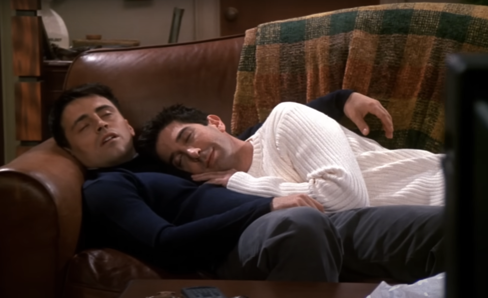 Joey and Ross from "Friends" asleep, cuddling on the couch