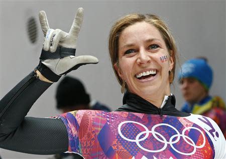 Noelle Pikus-Pace of the U.S. reacts after competing in the women's skeleton event at the 2014 Sochi Winter Olympics, at the Sanki Sliding Center in Rosa Khutor February 14, 2014. REUTERS/Arnd Wiegmann