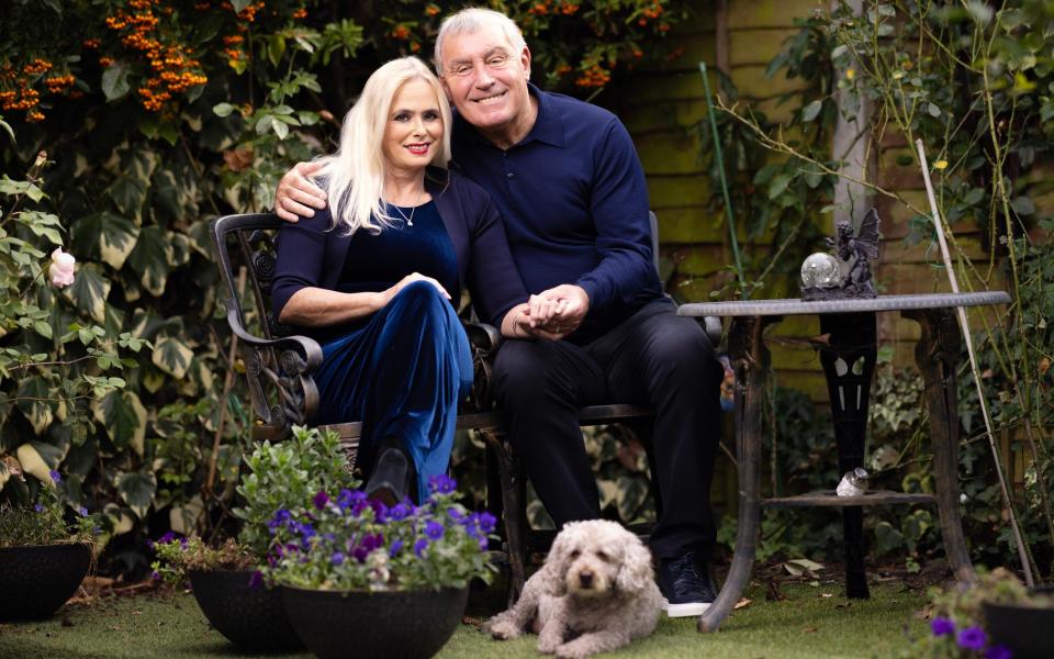 Peter and Steph Shilton, and their dog Charlie, in their garden in Essex