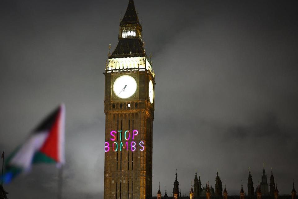 Messages were projected onto Big Ben during a protest on Wednesday (AFP via Getty Images)