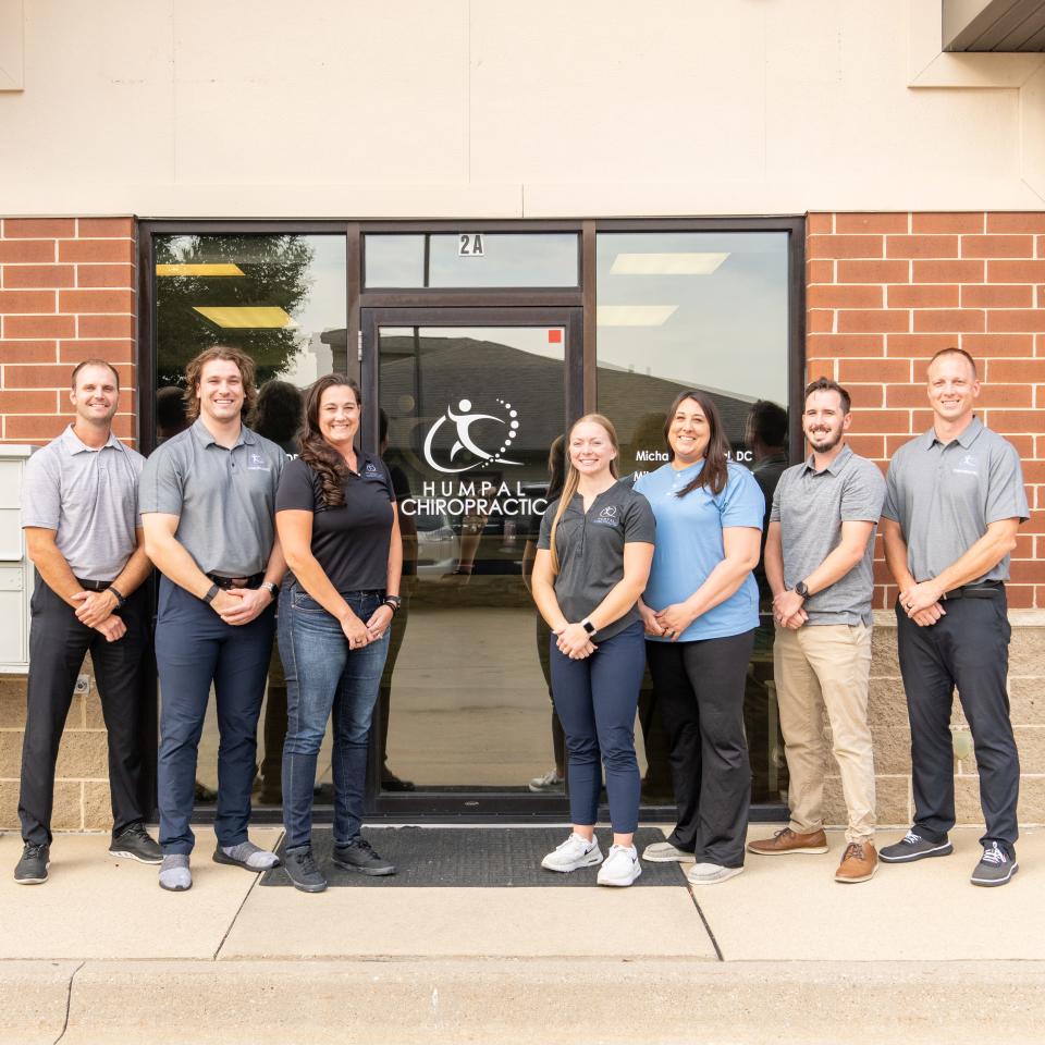 Humpal Chiropratic staff stand outside the new and updated location in North Liberty. Mike Humpal is a former Iowa linebacker who won a Super Bowl with the Pittsburgh Steelers.