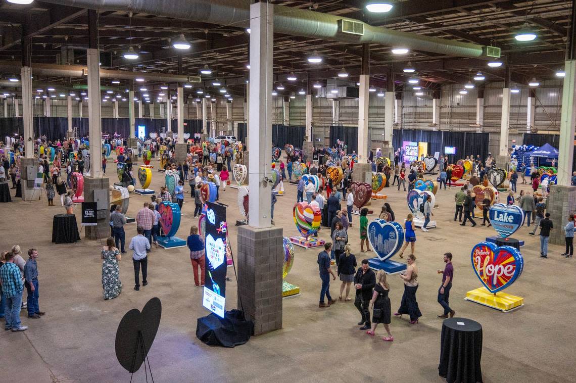 Visitors gather to see the Parade of Hearts reveal kickoff event at the Friday at the American Royal complex.