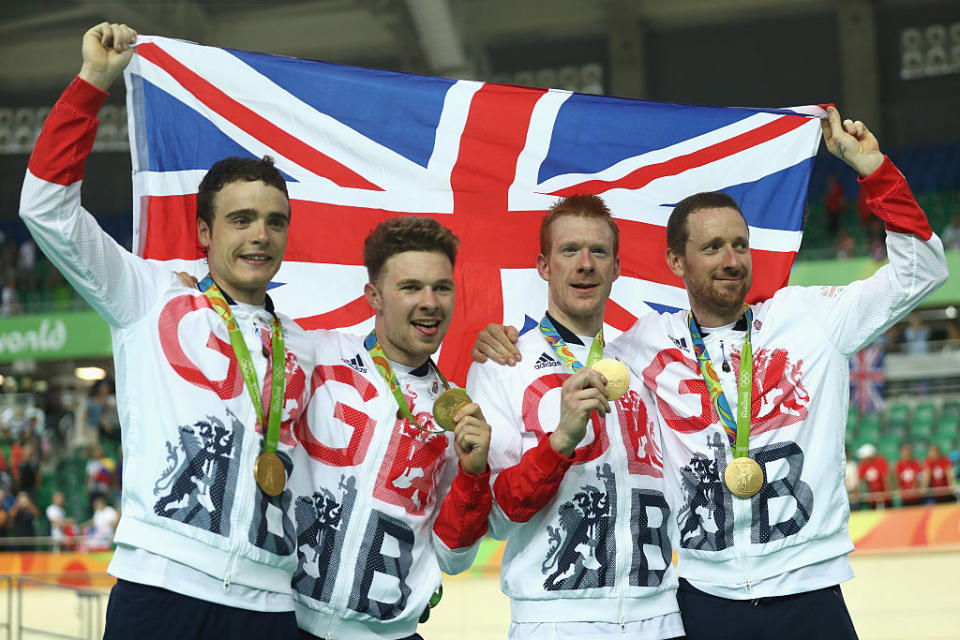 Team Great Britain's Steven Burke, Owain Doull, Edward Clancy and Bradley Wiggins celebrate their gold medal in cycling. (Getty Images)