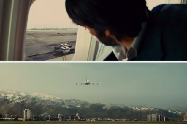 A man looks out a window as police cars chase his plane