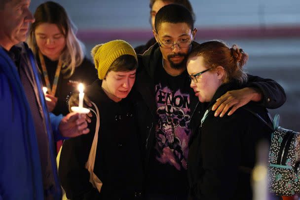 PHOTO: People hold a vigil at a makeshift memorial near the Club Q nightclub on Nov. 20, 2022 in Colorado Springs, Colorado. (Scott Olson/Getty Images)