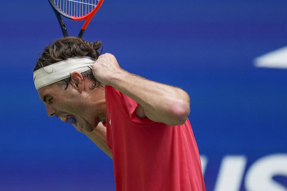 Taylor Fritz, of the United States, reacts during a match against Novak Djokovic, of Serbia, during the quarterfinals of the U.S. Open tennis championships, Tuesday, Sept. 5, 2023, in New York. (AP Photo/Seth Wenig)