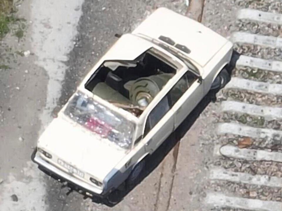 A car on the Kakhovka Dam that appears to be laden with explosives (AP)