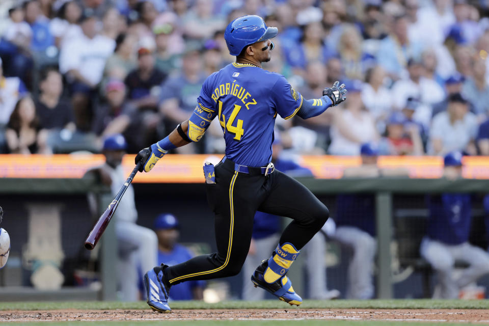 Seattle Mariners' Julio Rodriguez hits a single against the Toronto Blue Jays during the third inning in a baseball game, Friday, July 5, 2024, in Seattle. (AP Photo/John Froschauer)