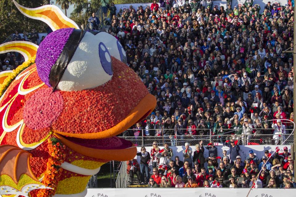 Sierra Madre Rose Float Association float " Catching the Big One" moving along Orange Grove Boulevard / Colorado Boulevard during the 125th Tournament of Roses Parade in Pasadena, Calif., Wednesday, Jan. 1, 2014. (AP Photo/Ringo H.W. Chiu)