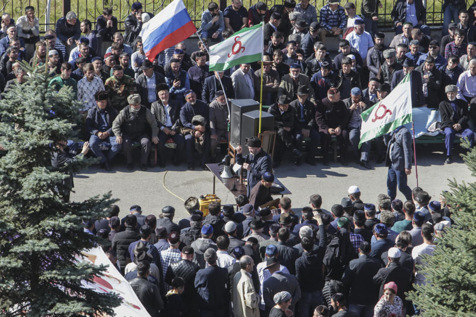 People attend a protest against the new land swap deal agreed by the heads of the Russian regions of Ingushetia and Chechnya, in Ingushetia's capital Magas, Russia, Monday, Oct. 8, 2018. Ingushetia and the neighboring province of Chechnya last month signed a deal to exchange what they described as unpopulated plots of agricultural land, but the deal triggered massive protests in Ingushetia where it was seen by many as hurting Ingushetia’s interests. (AP Photo/Musa Sadulayev)