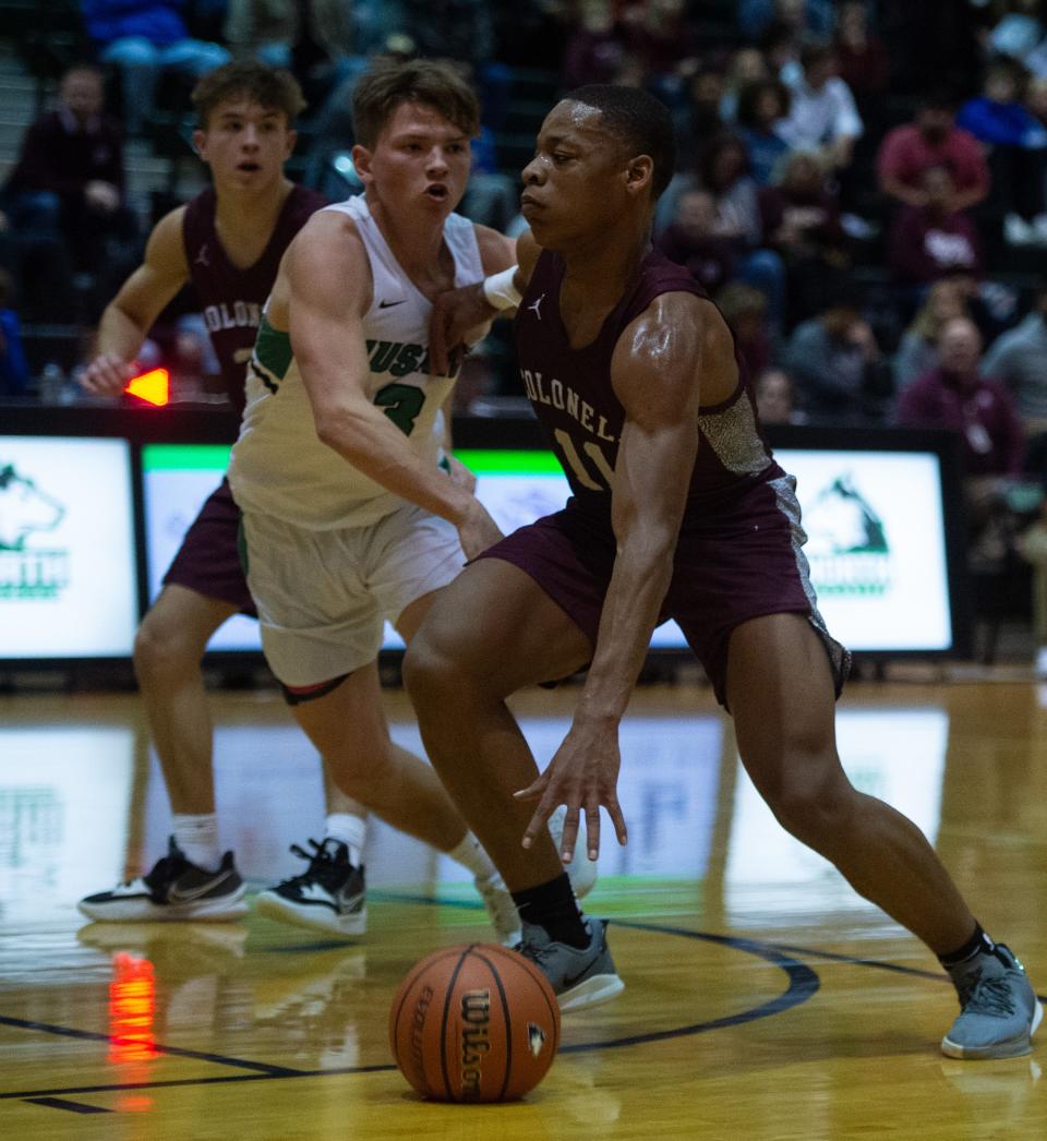 Henderson’s Gerard Thomas (11) drives the ball past North’s Sam McKinney (3) as the Henderson County Colonels play the North Huskies during the 2022 Evansville North Showcase at North High School in Evansville, Ind., Saturday evening, Dec. 3, 2022.