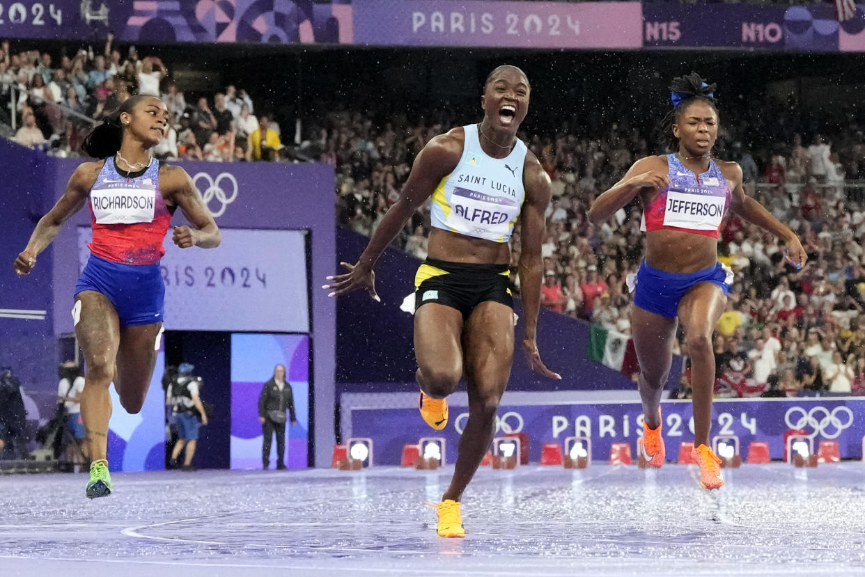 Julien Alfred, of Saint Lucia, celebrates after winning the women's 100-meter final at the Summer Olympics in France on Saturday. 