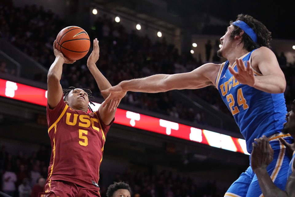 Southern California guard Boogie Ellis (5) shoots as UCLA guard Jaime Jaquez Jr. (24) defends during the second half of an NCAA college basketball game Thursday, Jan. 26, 2023, in Los Angeles. (AP Photo/Mark J. Terrill)
